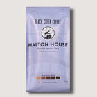 Coffee package from Black Creek Coffee with 'Halton House' branding on a light gray background